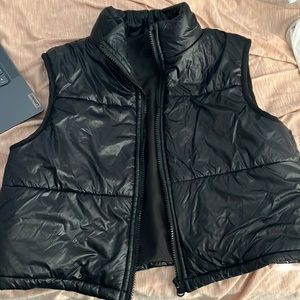 Cropped black vest size 14 for girls but size XS for women.